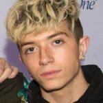 Ex-girlfriend of boy band member charged with trying to hire a hitman to kill him