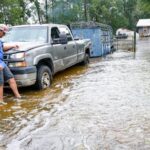 Edouard, now a tropical depression, drenches Texas with flash flooding and downed trees