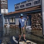 King tides inundate streets and flood homes and businesses along both US coasts